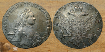 Иванов Тимофей Иванович. Монета `Серебряный рубль, образца 1762 года`. Серебро, чеканка. D-3,8. 1764. Архангельский краеведческий музей.